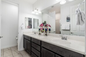 Shower, hair dryer, towels, shampoo
