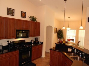 Fridge, coffee/tea maker, cookware/dishes/utensils