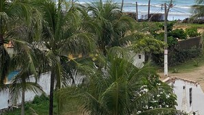 A coastal view with palm trees and a clear sky. - Porto Atlantis Vista Mar 308 by La Playa (Ipojuca)
