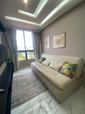 Apartamento luxo, vista para o mar | Área de estar