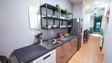 Full-size fridge, microwave, stovetop, dishwasher