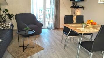 Apartment (Superior Two Bedroom Apartment with B) | Living room | 32-inch flat-screen TV with cable channels