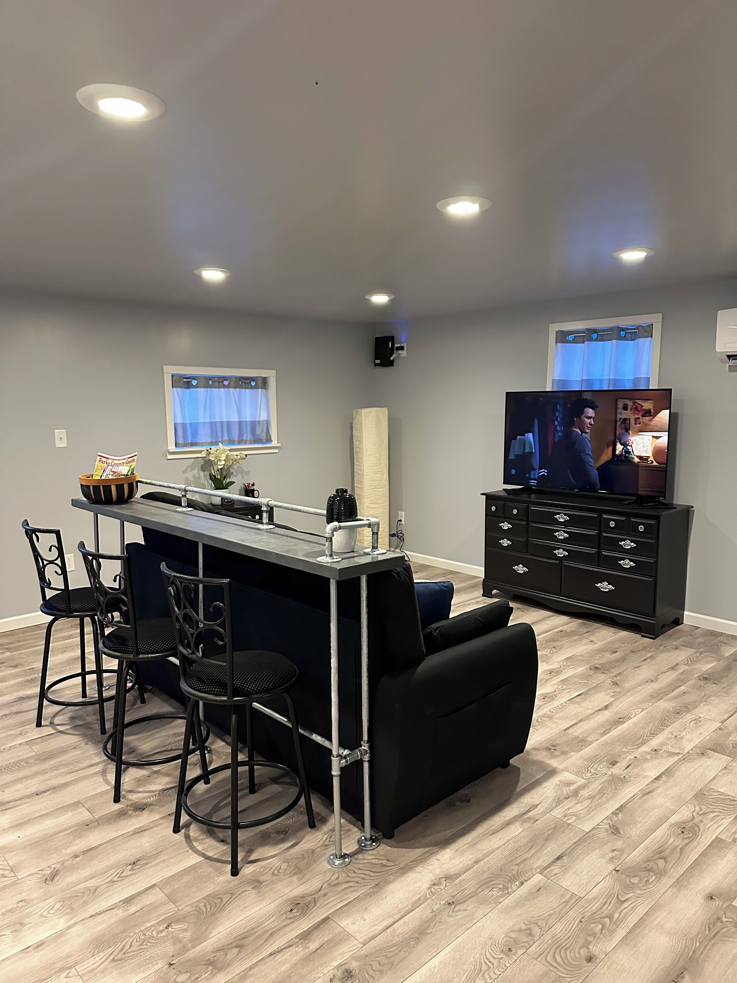 Living room with sleeper sofa and bar top table