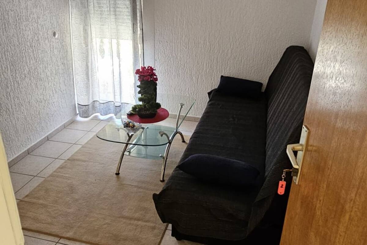 Apartment (Two Bedroom Apartment with Balcony an) | Living room | 32-inch flat-screen TV with cable channels