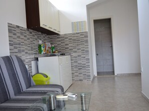 Apartment (One Bedroom Apartment with Balcony) | Living room | 32-inch flat-screen TV with cable channels
