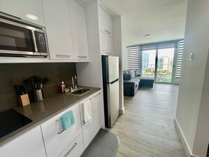 Fridge, microwave, stovetop, coffee/tea maker