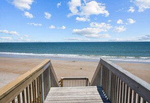 Walk along the boardwalk to the sandy beach.