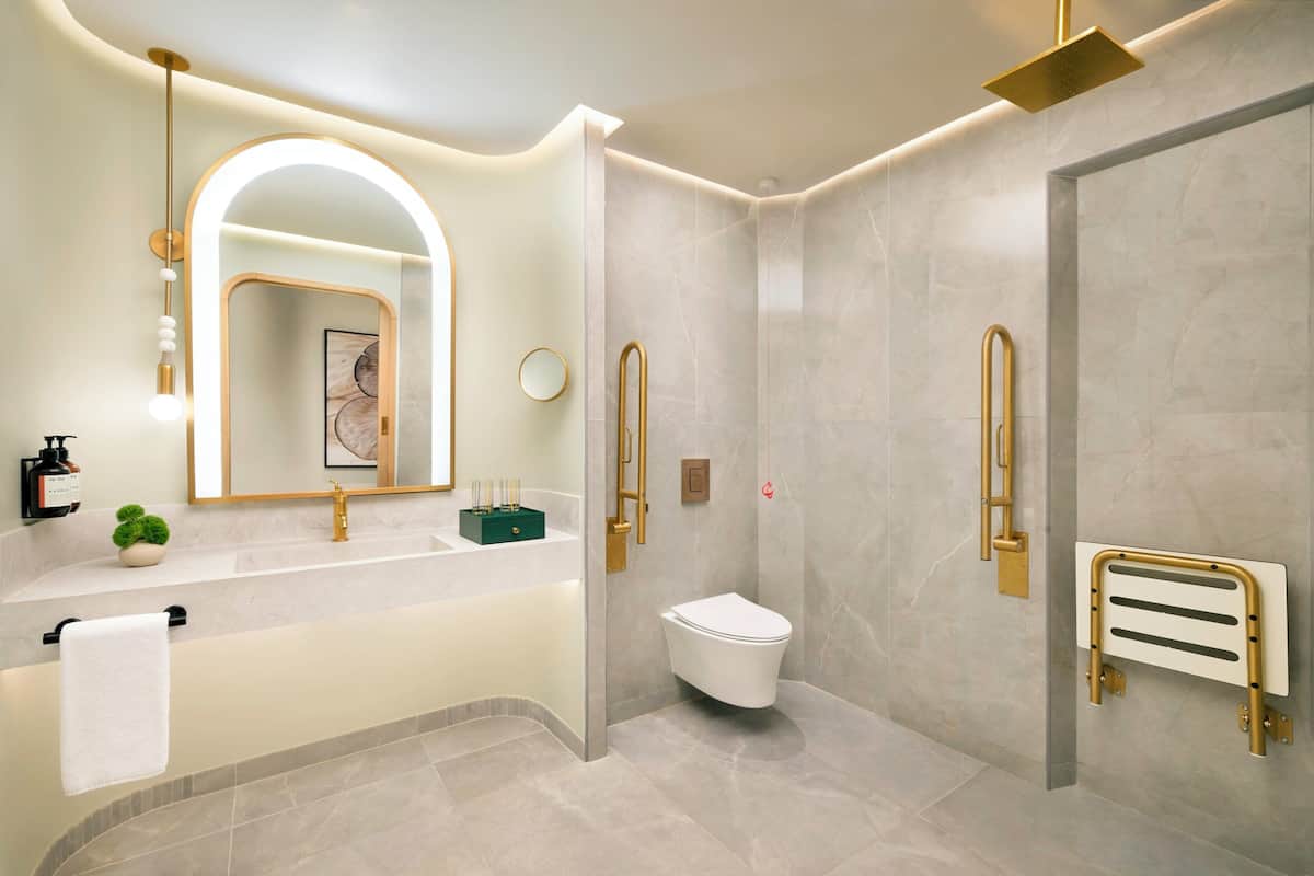 Room, 1 King Bed, Accessible (Essential) | Bathroom | Hair dryer, slippers, towels, soap
