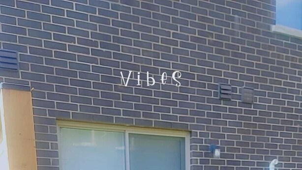 A building with a brick exterior, a sliding glass door, and a small window. - Modern Suite Near Hamilton Airport (Hamilton)