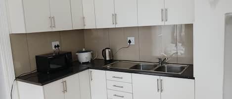 Economy Shared Dormitory, Patio, City View | Private kitchen | Fridge, microwave, stovetop, cookware/dishes/utensils