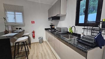 Fridge, microwave, coffee/tea maker, toaster