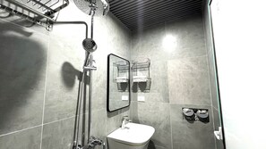 Deluxe Studio, Balcony, City View | Bathroom | Shower, hair dryer, slippers, towels