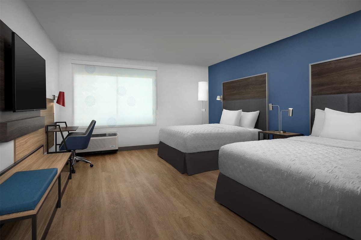 Premium bedding, desk, laptop workspace, blackout curtains