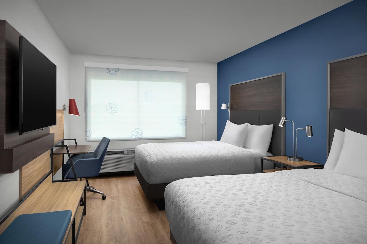 Premium bedding, desk, laptop workspace, blackout curtains