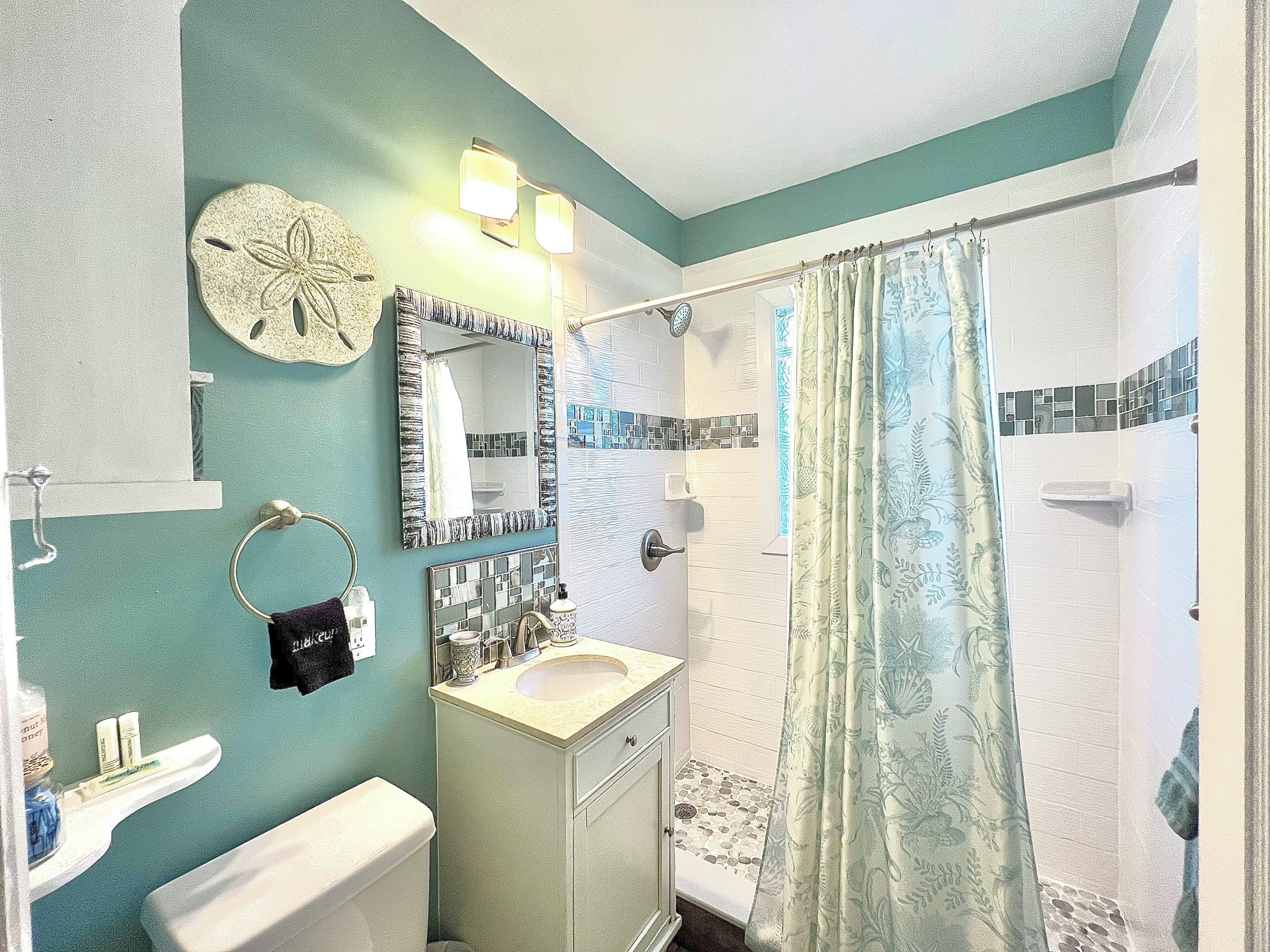 Shower, hair dryer, towels, soap