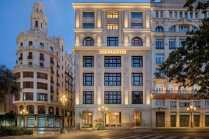 A grand, multi-story hotel with a classic architectural design, featuring large windows and a prominent entrance. - Grand Hotel Centenari, Valencia, Autograph Collection (Valencia)