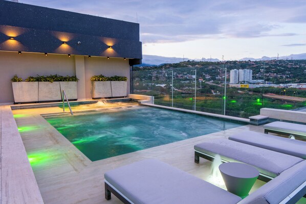 Outdoor pool, open 9:00 AM to 8:00 PM, pool loungers