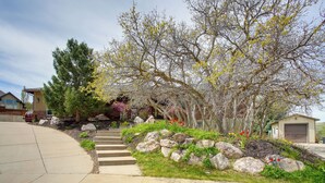 A residential driveway with a stone pathway leading to a garage. - Hike, Golf, Ski & More: Family Home in South Weber (South Weber)