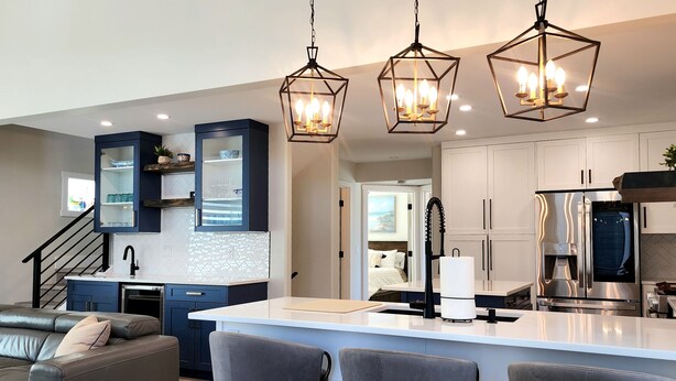 A modern kitchen with a central island, built-in cabinets, and pendant lighting. - Stunning Modern Cottage at La Casa Lakeside Resort (Kelowna)