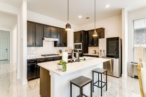 Microwave, stovetop, dishwasher, coffee/tea maker