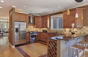 Fridge, microwave, oven, stovetop - Spacious & Stylish Home with Garage + Rooftop Deck. 10 min Walk to Train. (Chicago)