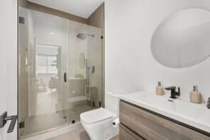 Shower, hair dryer, towels, soap