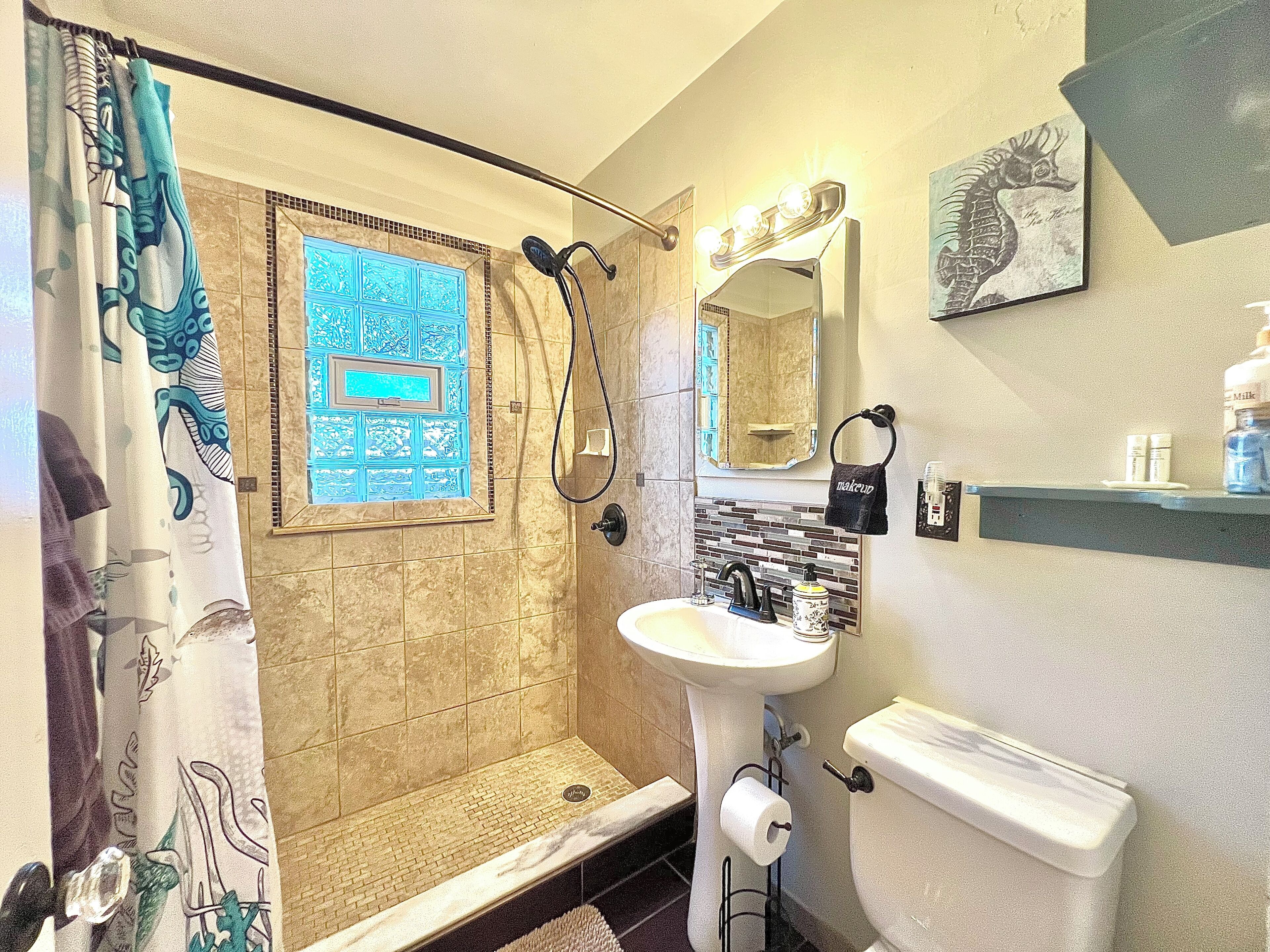 Shower, hair dryer, towels, soap