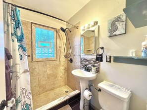 Shower, hair dryer, towels, soap