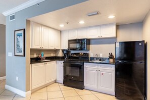 Fridge, microwave, stovetop, coffee/tea maker
