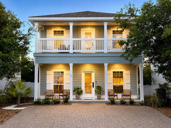 A two-story house with a front porch, two balconies, and a brick driveway. - Beach House Sleeps 8. Five min walk to beach access - 30A & Rosemary Beach. (Inlet Beach)