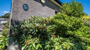 A building with a stone facade and a plaque indicating a 4-star accommodation rating. - The Stables at Ballygraffan, outside. Comber - Harry's Stable (Comber)