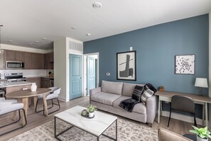 Apartment, 2 Bedrooms | Living area | 50-inch TV with digital channels - Landing Apartments Leland (Leland)