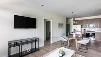 Apartment, 2 Bedrooms | Living area | 50-inch TV with digital channels