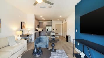 Apartment, 1 Bedroom | Living room | 50-inch TV with digital channels