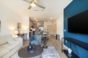 Apartment, 1 Bedroom | Living room | 50-inch TV with digital channels