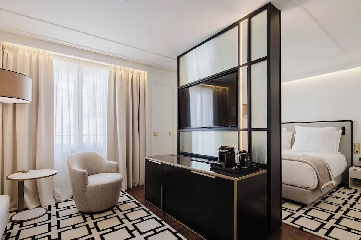 Junior Studio Suite, City View | In-room safe, laptop workspace, blackout drapes, soundproofing
