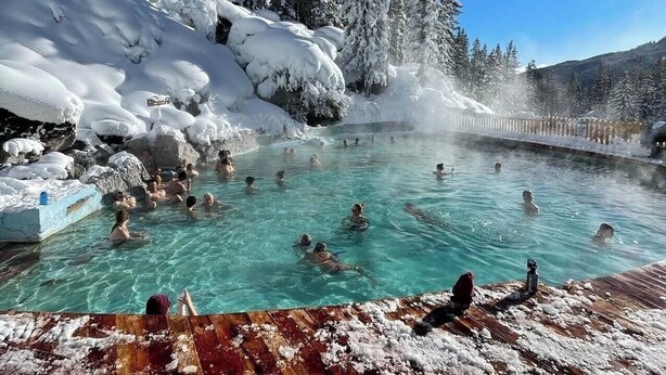 A hot spring surrounded by snow-covered trees and rocks. - Middle Teton 2N | Stunning Views + Private Balcony (Driggs)