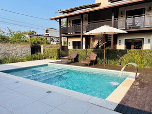 Outdoor pool, pool umbrellas, sun loungers