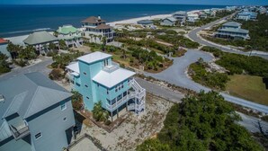 A coastal residential area with houses, a beach, and a clear view of the ocean. - DuneFine Cape San Blas Sleeps 10 & Dog Friendly Private Pool (Cape San Blas)