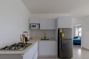 Fridge, microwave, stovetop, coffee/tea maker