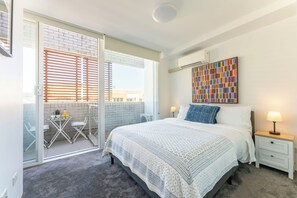 1 bedroom, desk, iron/ironing board, travel crib