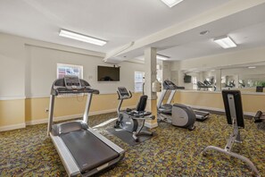 A gym with treadmills, elliptical machines, and a stationary bike. - The Wright Place: Pet Friendly, Oceanfront Condo with Great Views and Access to Community Amenities! (Kill Devil Hills)