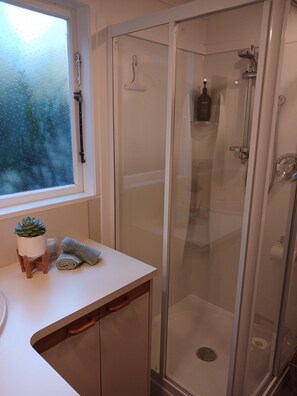 Shower, hair dryer, towels, soap
