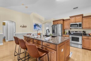 Fridge, microwave, oven, stovetop - Heated Pool with Freshwater Canal View - Tropical Oasis - Roelens (Cape Coral)