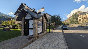 A stone building with a sign indicating it's a guesthouse.