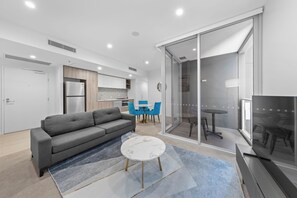 One Bedroom Apartment | Living area | 28-inch TV with satellite channels - Art House Apartments by CLLIX (South Brisbane)