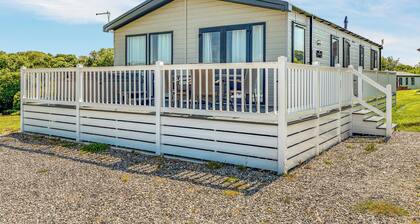 Escape to the Jasmine Lodge, nestled amidst stunning rolling countryside.