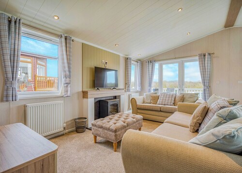Escape to the Jasmine Lodge, nestled amidst stunning rolling countryside.