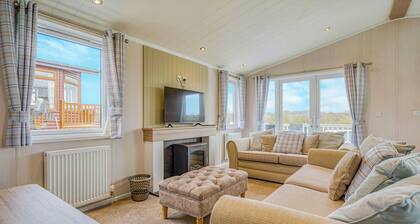 Escape to the Jasmine Lodge, nestled amidst stunning rolling countryside.