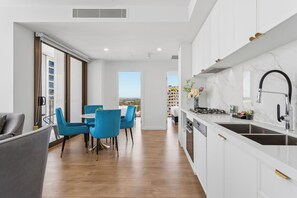 Two Bedroom Two Bathroom Apartment | Living area | 24-inch flat-screen TV with cable channels - The Cullinan Apartments by CLLIX (Adelaide)